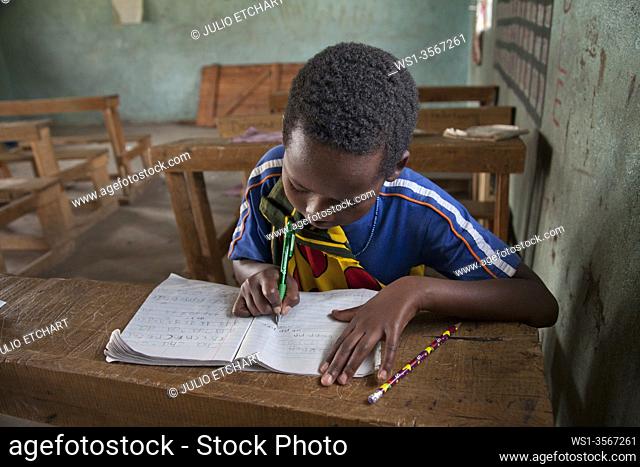 Girl in classroom in the school in Losho , next to the Masai Mara Nature Reserve, Kenya