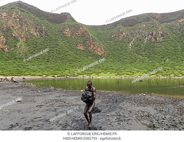 Ethiopia, Oromia, El Sod, Borana tribe man carrying salt taken from the lake of el sod volcano