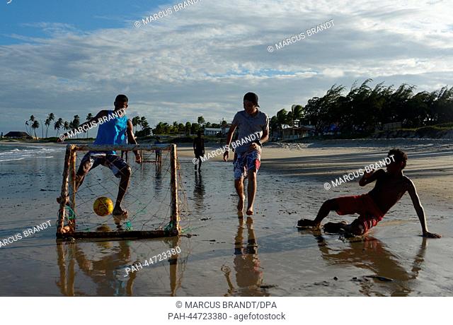 A group of Brazilian youths play a match of beach soccer on a beach near the city of Natal, Brazil, 8 December 2013. Brazil is preparing for the forthcoming...