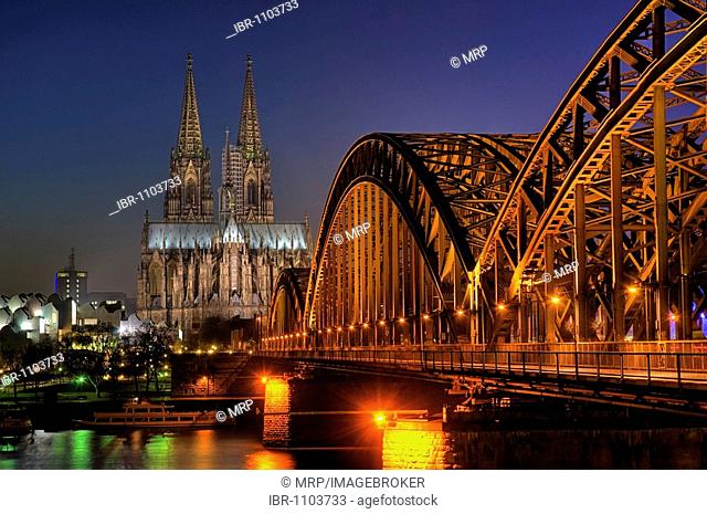 Cologne Cathedral, Hohenzollernbruecke Bridge at night, North Rhine-Westfalia, Germany, Europe
