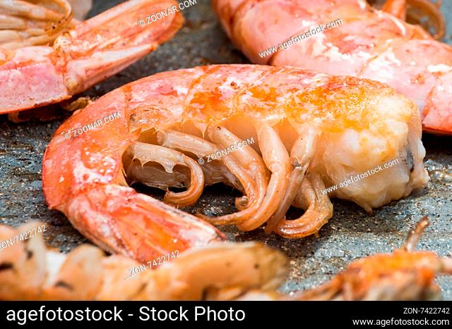 In the picture of cooked shrimp close-up to the plate