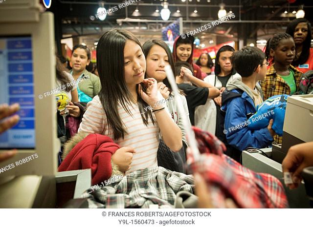 NYC Public School students on line to pay for purchases after shopping at Old Navy's flagship store on 34th street in New York  The students were given a fifty...