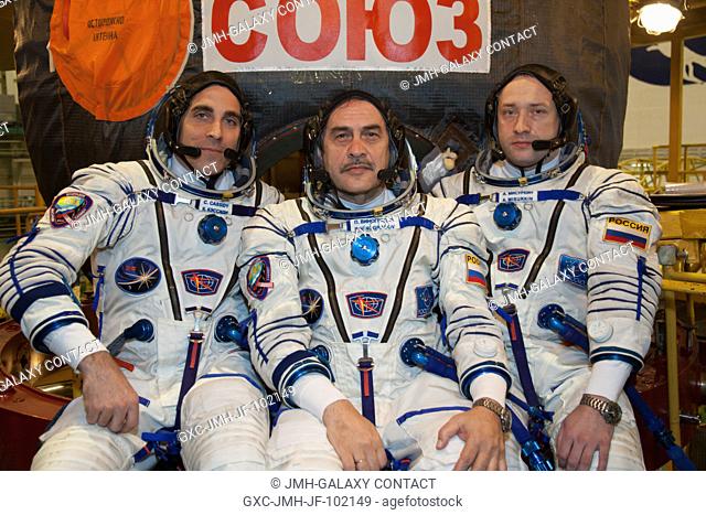 In the Integration Facility at the Baikonur Cosmodrome in Kazakhstan, the Expedition 3536 prime crew members pose for pictures March 17 during a systems dress...