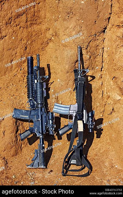 Two M4 Carbines, at a Small, Remote, Austere U.S. Marine Corps Combat Outpost in Afghanistan's Helmand Province. M4 on Left is Fitted With an M203 40mm Grenade...