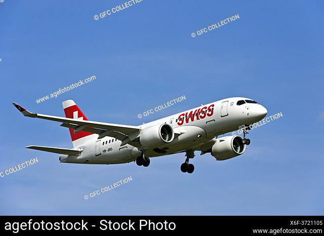 Aircraft Bombardier A220-100 of the airline Swiss International Air Lines approaching Geneva airport, Geneva, Switzerland