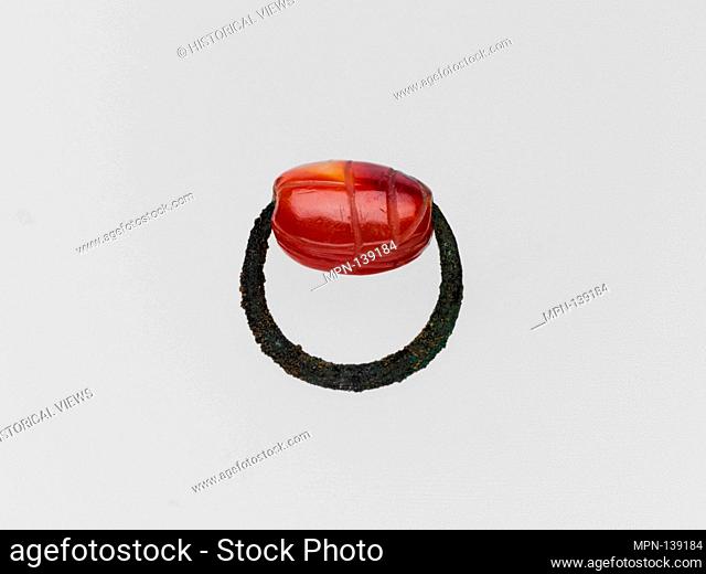 Bronze ring with carnelian scarab. Period: Archaic; Date: 6th-5th century B.C; Culture: Greek; Medium: Bronze, sard; Dimensions: Diameter: 7/8 in. (2