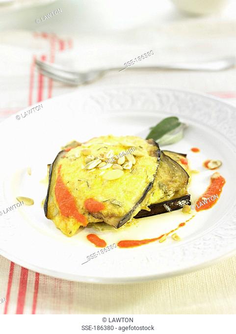 Eggplants with emmental and seeds, red pepper sauce
