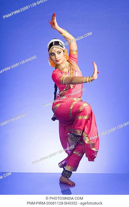 Woman performing Pataka mudra of Bharatnatyam