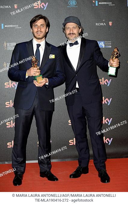 Luca Marinelli Best Supporting actor prize and Claudio Santamaria Best actor prize at the red carpet of winners for the David of Donatello prize, Rome
