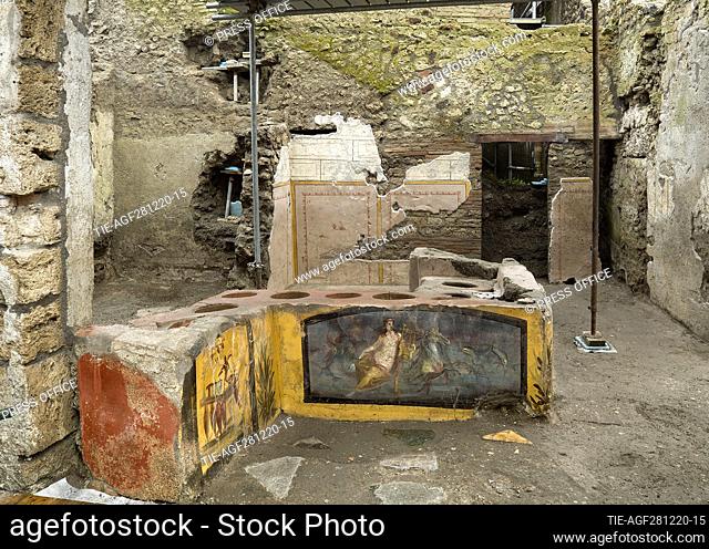 An undated handout photo made available by the Archaeological Park of Pompeii on 26 December 2020 shows a newly unearthed 'Thermopolium' at the archaeological...