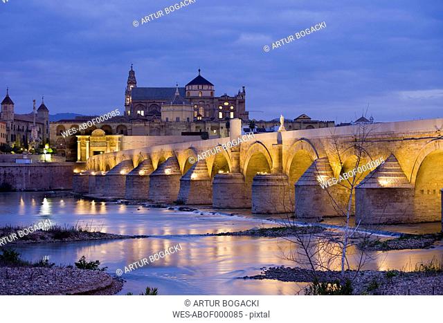 Spain, Andalusia, Cordoba, Mezquita Mosque Cathedral at dawn, Roman Bridge on Guadalquivir river