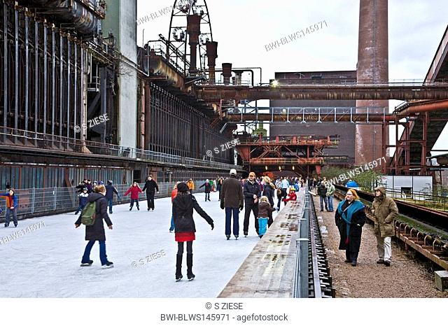 people on the skating rink of the coking plant Zollverein in winter, Germany, North Rhine-Westphalia, Ruhr Area, Essen-Katernberg