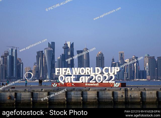 15 December 2022, Qatar, Doha: The lettering ""Fifa World Cup Qatar 2022"" stands in front of the skyline in Doha. Photo: Tom Weller/dpa. - Doha/Qatar