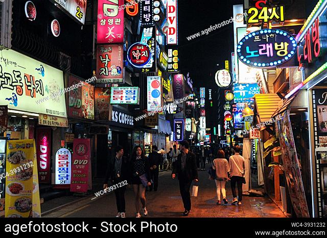 Seoul, South Korea, Asia - People wander through neon-lit streets and alleys of the busy Insadong entertainment district at night that is lined with bars