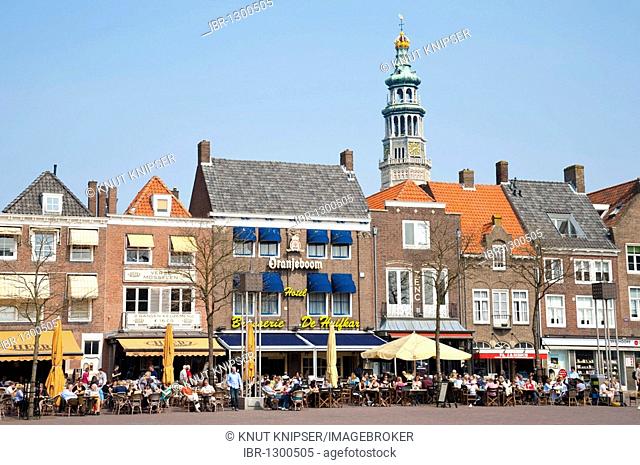 Houses at the market square in front of the abbey tower Lange Jan in Middelburg, Walcheren, Zeeland, Netherlands, Europe