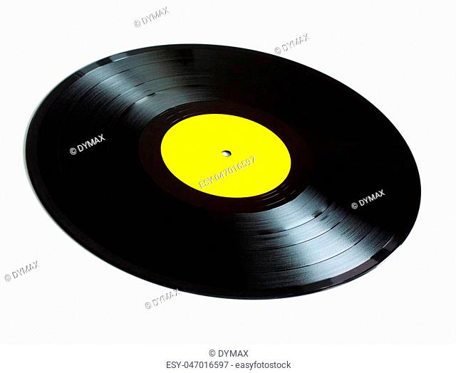 Black long-play vinyl records with yellow label isolated on white background. Side view closeup