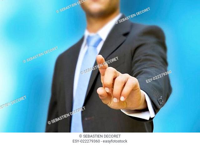 Businessman touching tactile screen with his hand