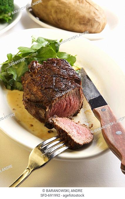 Filet Mignon Cooked Medium Rare, Fork and Knife
