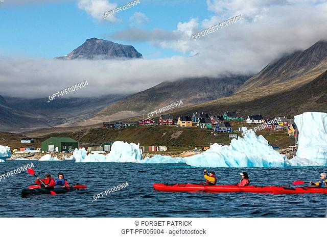 KAYAKING IN THE MIDDLE OF THE ICEBERGS THAT SEPARATED FROM THE GLACIER, FJORD OF NARSAQ BAY, GREENLAND
