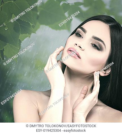 Beauty female portrait over natural background