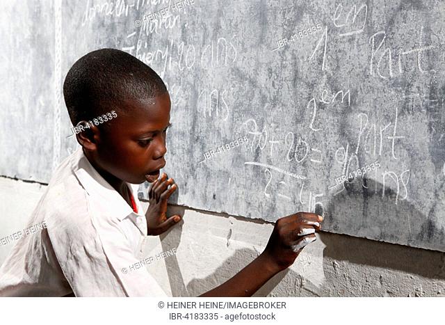 Student at the blackboard, in class, Zhinabukete, Kawongo district, Bandundu Province, Congo-Brazzaville