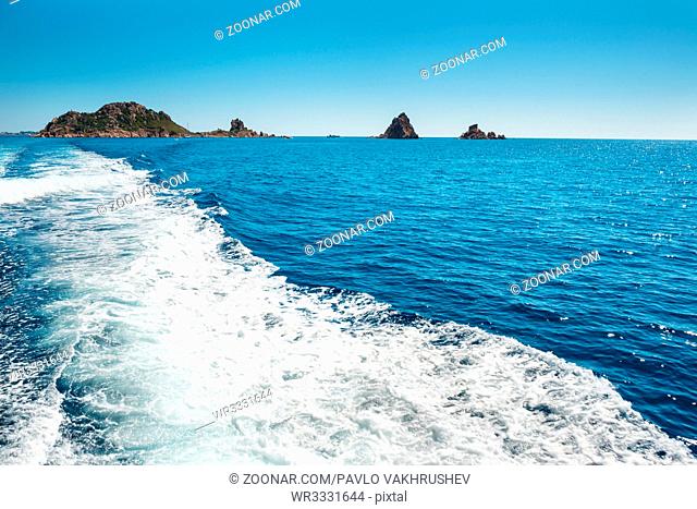 Waves on blue sea behind the speed boat water in sunny day
