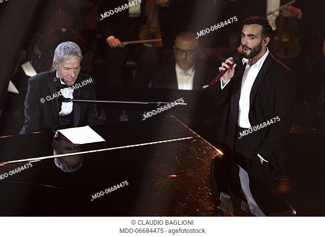 Italian singer Marco Mengoni and Italian singer and presenter Claudio Baglioni during the second evening of the 69th Sanremo Music Festival