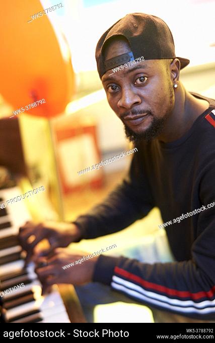 African man playing piano