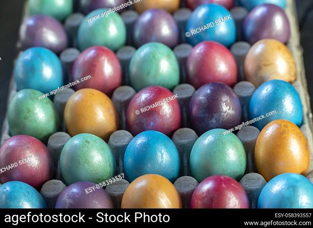 Easter background with hand painted purple, blue, green, orange