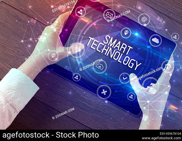 Close-up of a tablet with SMART TECHNOLOGY inscription, innovative technology concept