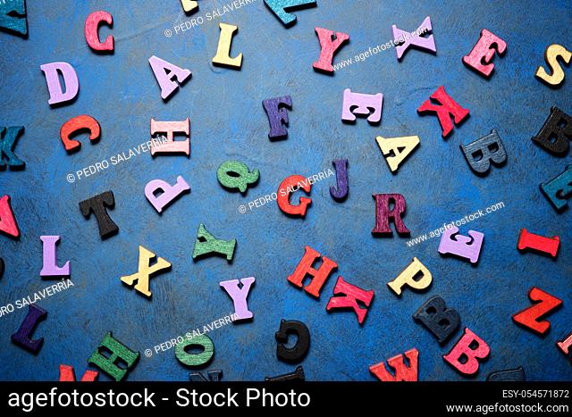 Wood letters on a blue table
