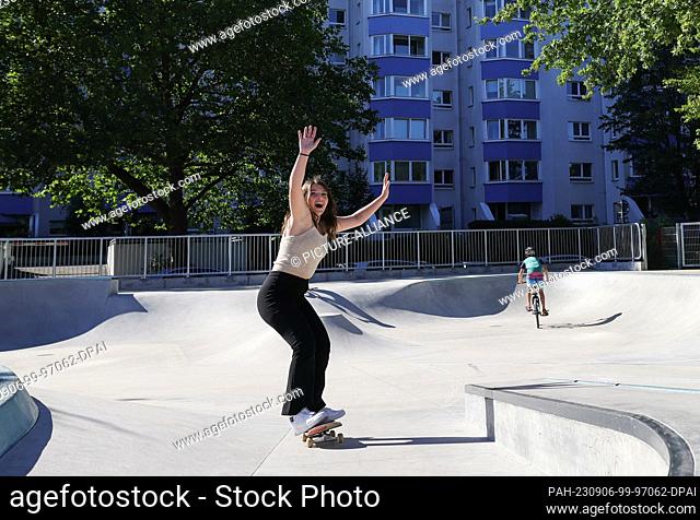 06 September 2023, Hamburg: Betül Korkmaz rides her skateboard at the new skate park in Lenzsiedlung. Hamburg's urban development senator Pein visited the...