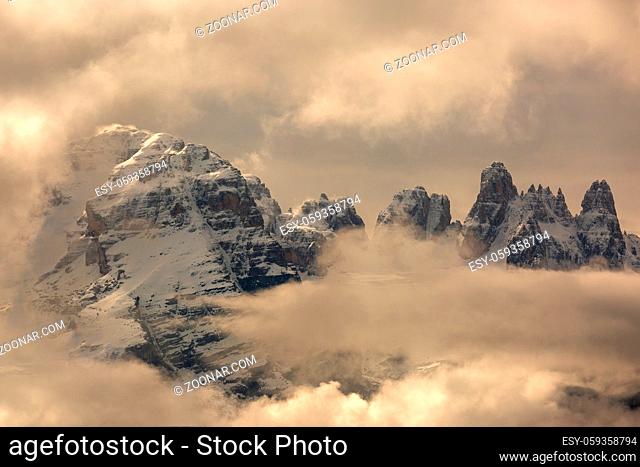 Snow-capped mountains in clouds landscape in alps, Adamello Brenta, Italy