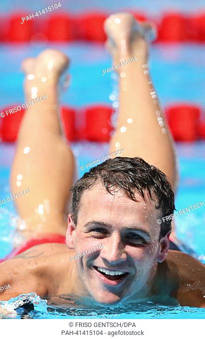 Ryan Lochte of USA smiles after men's 200m individual medley preliminaries of the 15th FINA Swimming World Championships at Palau Sant Jordi Arena in Barcelona