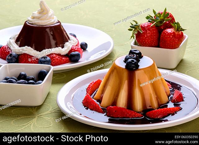 vanilla pudding with chocolate syrup and fruits
