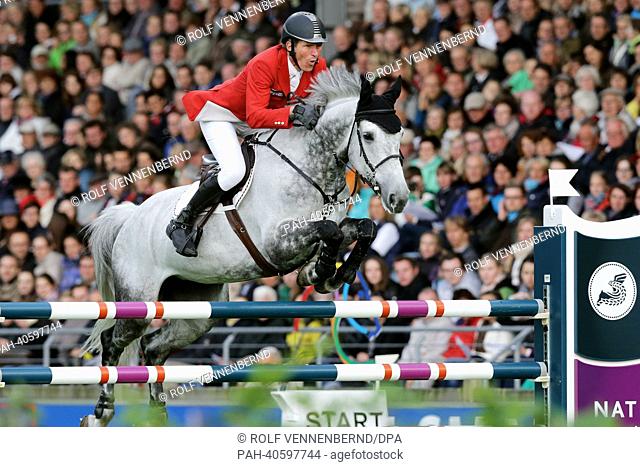 German equestrian Ludger Beerbaum jumps over an obstacle with his horse Chiara 222 during the Nations Cup of Germany at the international horse show CHIO in...