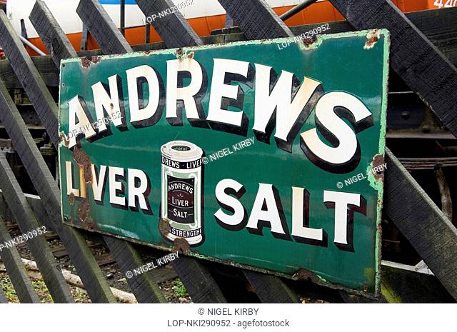 England, North Yorkshire, Goathland, Old rusty Andrews liver salt sign on the North York Moors Railway platform at Goathland station