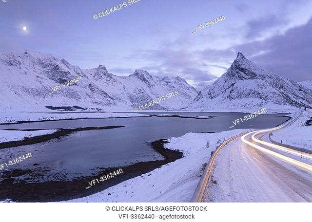Snowy road near Volanstinden. Fredvang, Lofoten Islands, Northern Norway, Europe