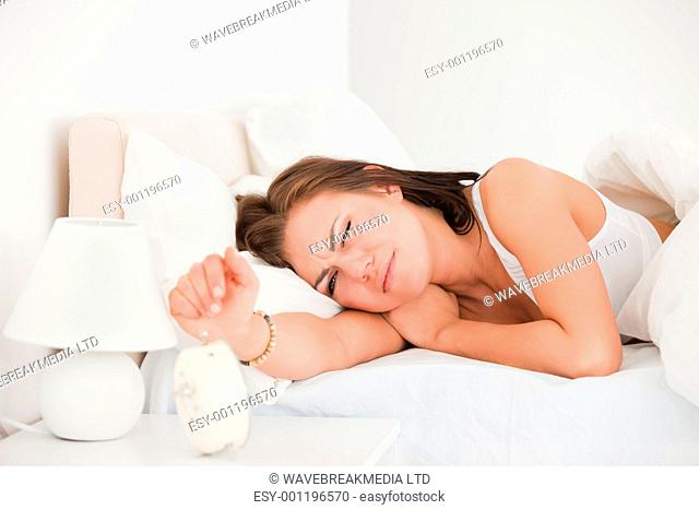 Beautiful woman waking up against a white background