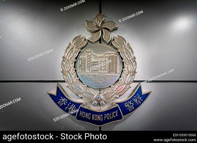 The Hong Kong police logo on the wall of police station