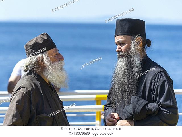 Orthodox monks on the ferry to Dafni, returning to their monasteries on the Athos peninsula, Chalkidiki, Macedonia, Northern Greece