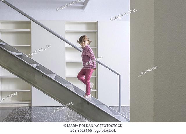 little girl going up the stairs