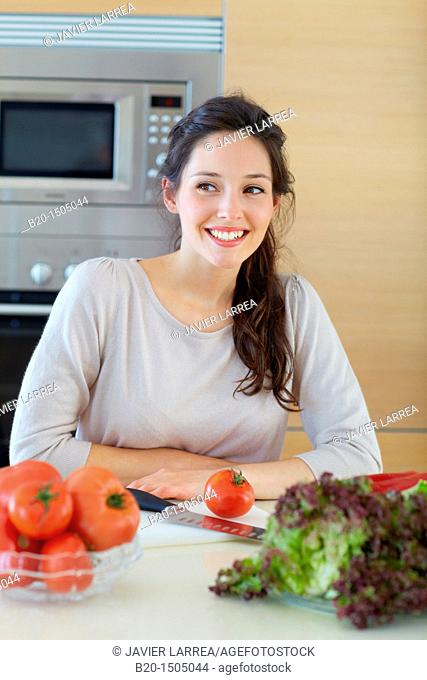 Young woman in kitchen
