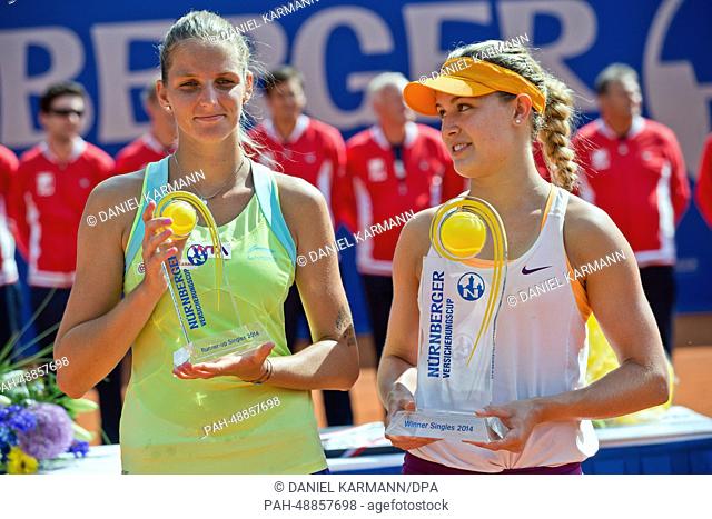 Canada's Eugenie Bouchard (R) and Czechia's Karolina Pliskova celebrate after the final match at the WTA tour in Nuremberg, Germany, 24 May 2014