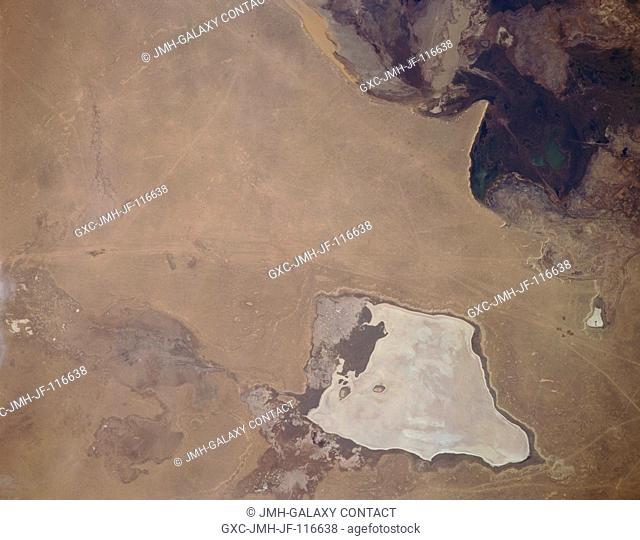 Barsa-Kel'mes Salt Flat, Uzbekistan November 1994. Located southwest of the Aral Sea on the eastern Ustyurt Plateau, the Barsa-Kel'mes Salt Flat (bottom center)...