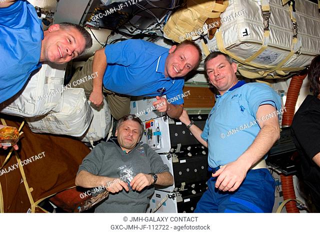 NASA astronauts Greg H. Johnson (top left), STS-134 pilot, and Michael Fincke (top center), STS-134 mission specialist; along with Russian cosmonauts Andrey...