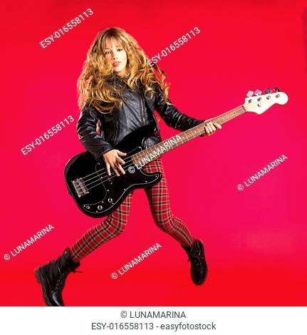 Blond Rock and roll girl jumping playing bass guitar on red background