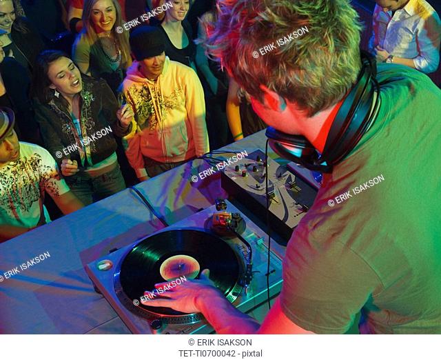 DJ playing in front of crowd