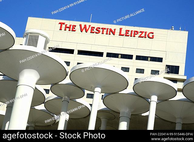 10 February 2022, Saxony, Leipzig: Behind tall columns define the entrance design of the Sächsische Aufbaubank, The Westin hotel can be seen.