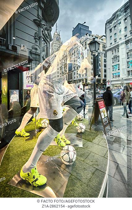 Mannequins and reflections at Real Madrid Official Store window shop at Gran Via street. Madrid. Spain